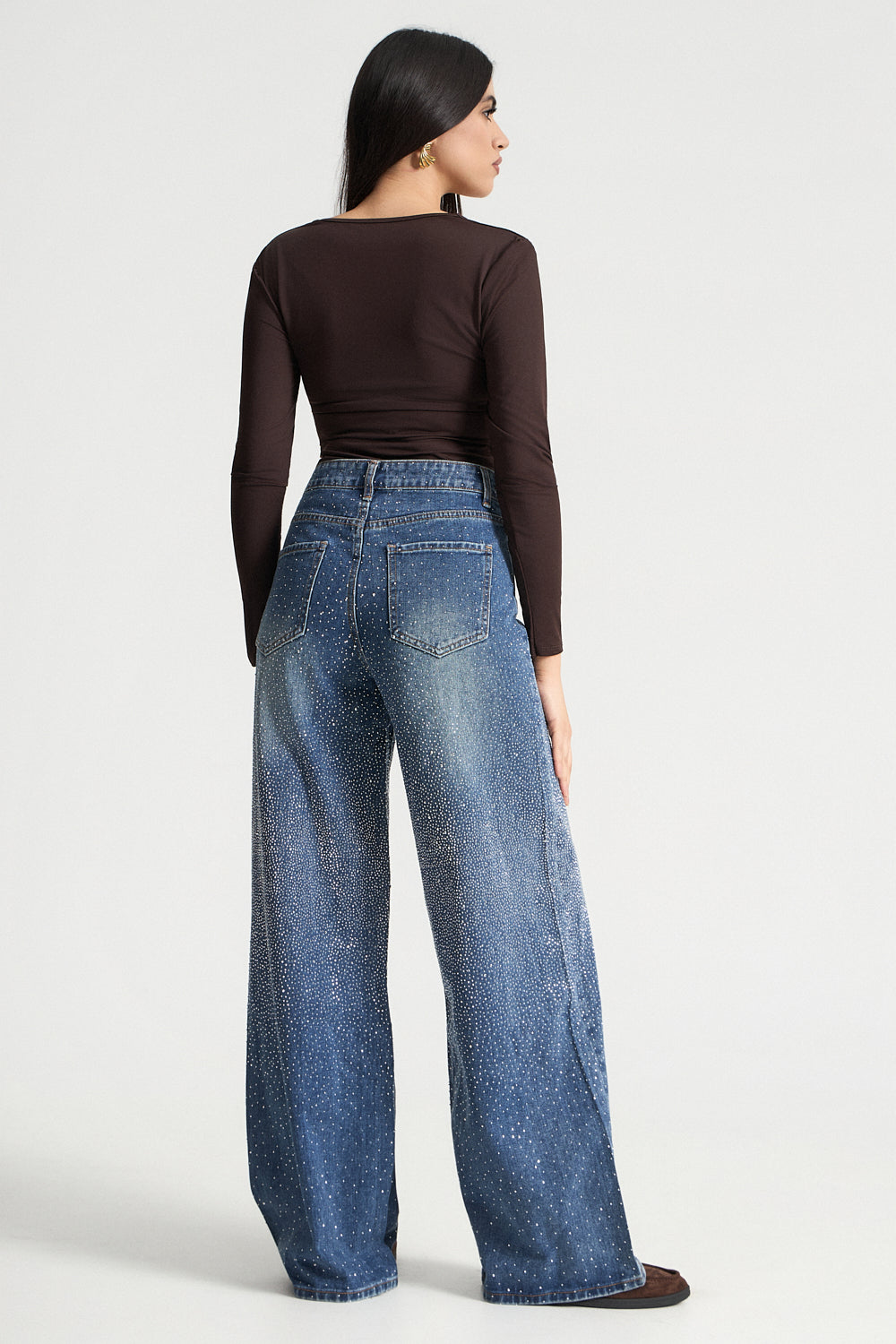 Τζιν παντελόνι με ασύμμετρο κουμπωμα και στρας